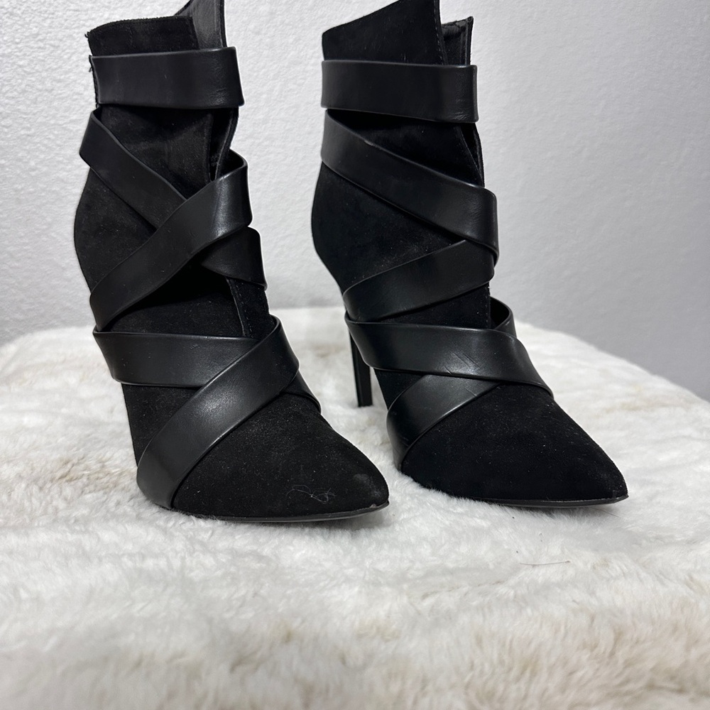 Sleek Black Heeled Boots with Stiletto Heel and Unique Wrap-Around Design